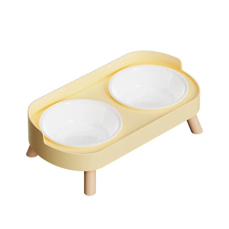 Double gamelle pour chat jaune sur fond blanc