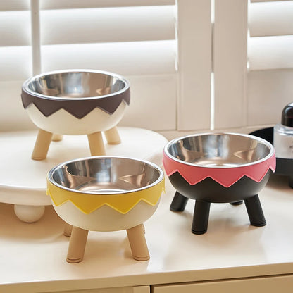 Gamelle Chat inox Surélevée gris, jaune et rose sur un étagère