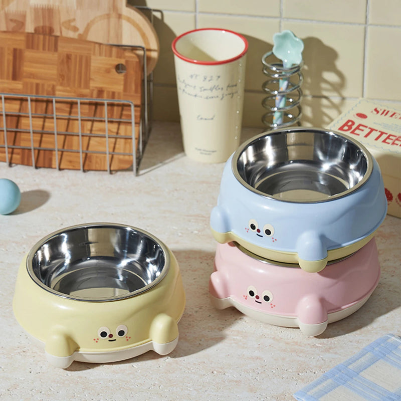 gamelle eau chat inox bleu, rose et jaune dans un fond cosy